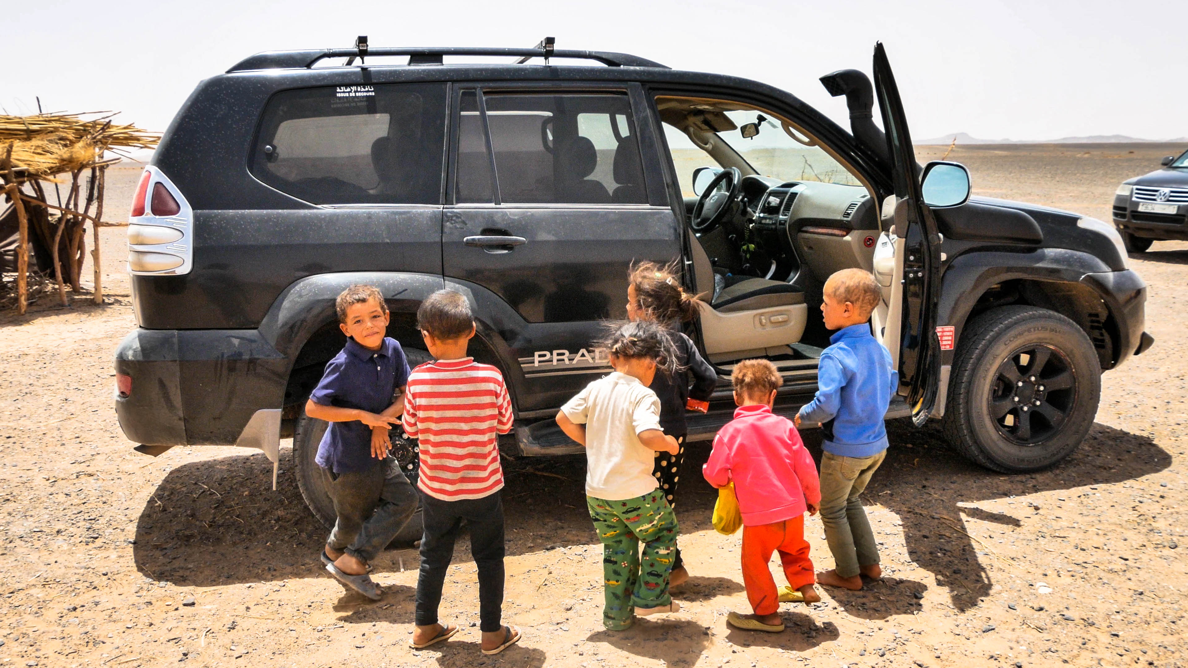 Nomadic kids dancing in the Sahara Desert in Morocco
