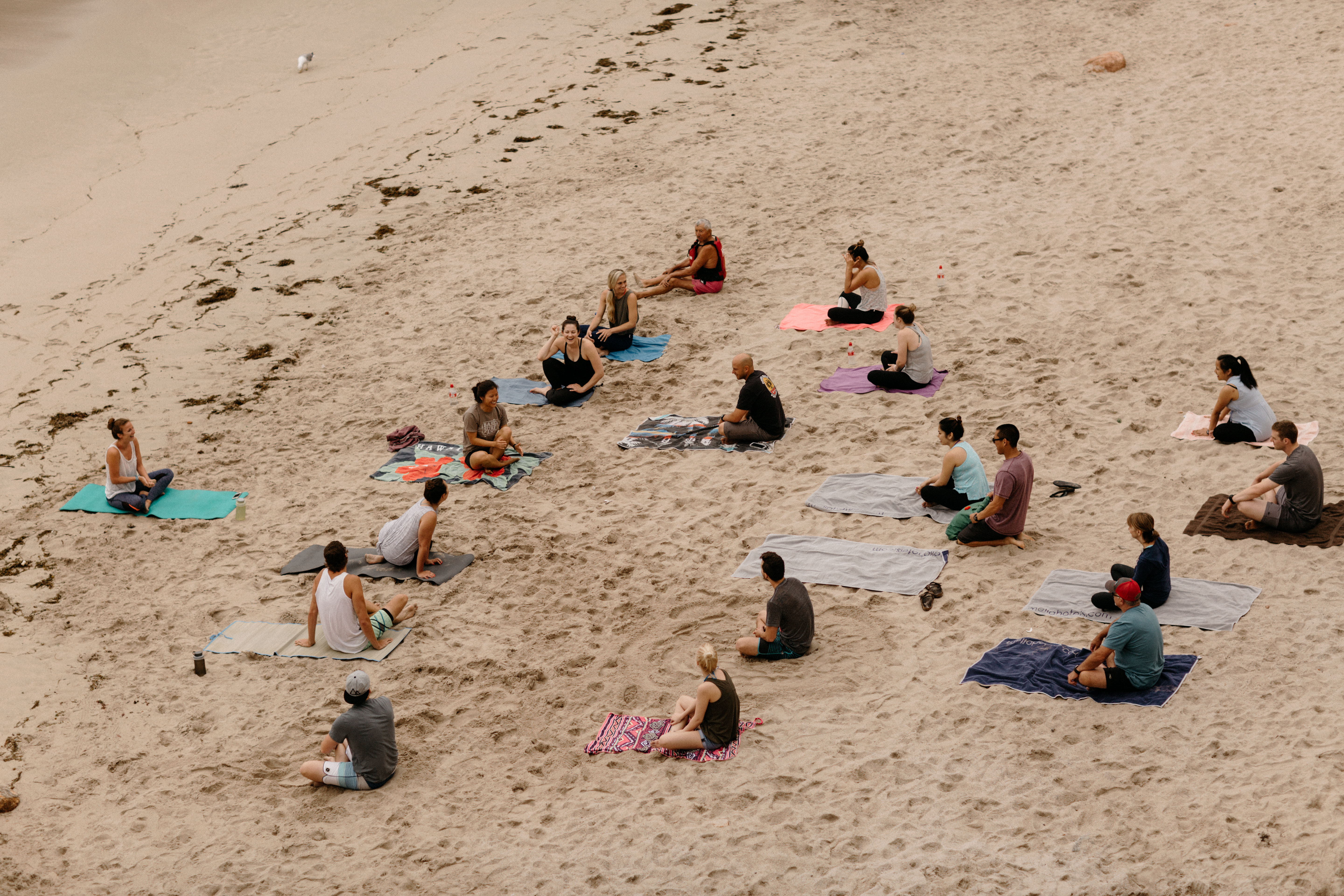 Beach yoga class with out of town wedding guests in Spain. Photos by Jonathan Gipaya