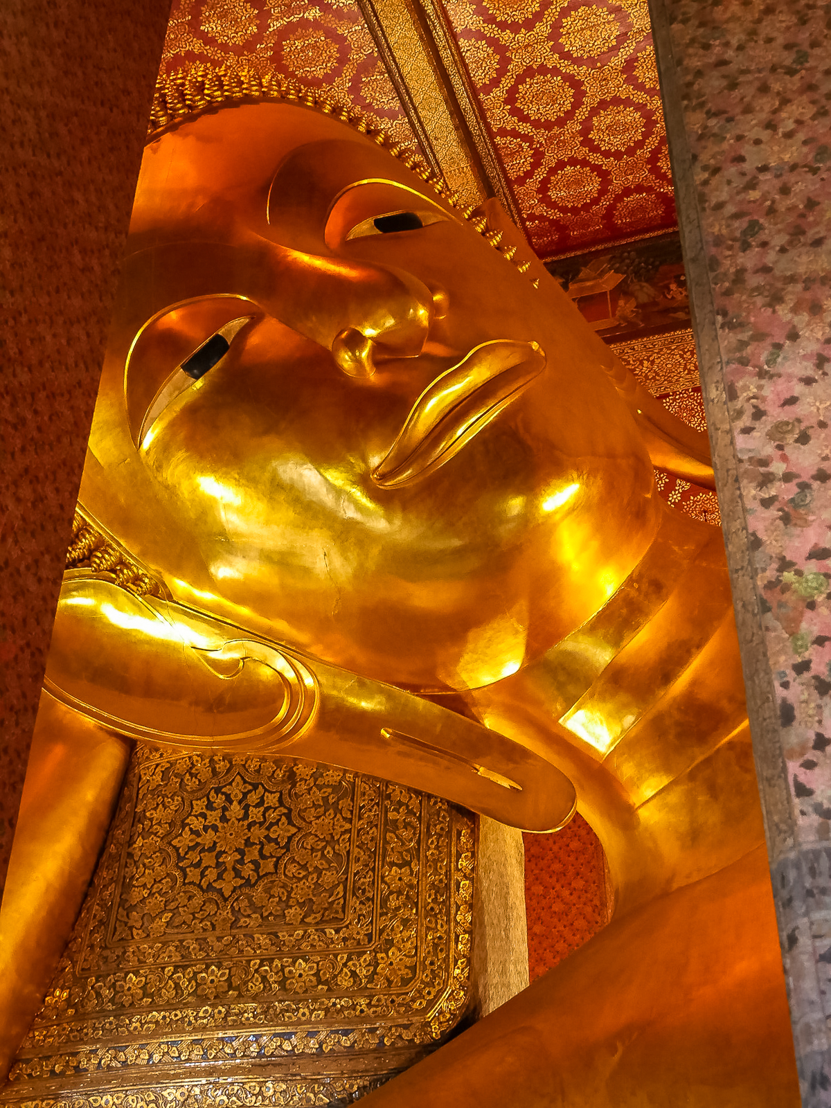 Head of the 150+ foot long reclining Buddha at Wat Pho in Bangkok