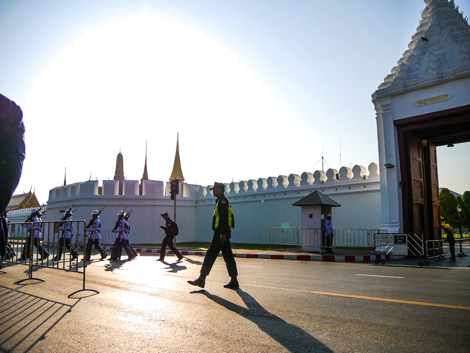 Guards marching outside the Grand Palace before it opens at 8:30 a.m.