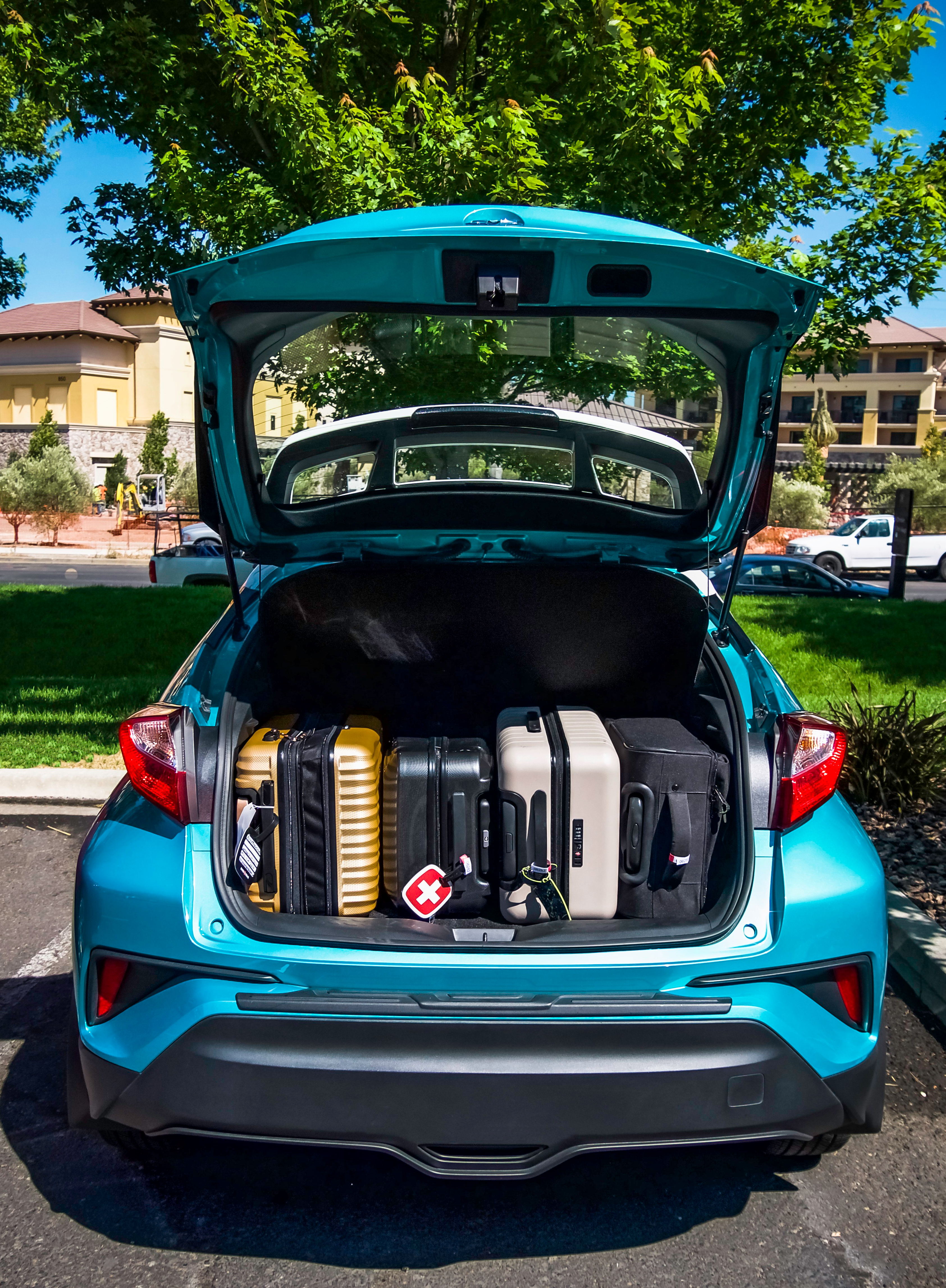 Toyota C-HR with suitcases in trunk