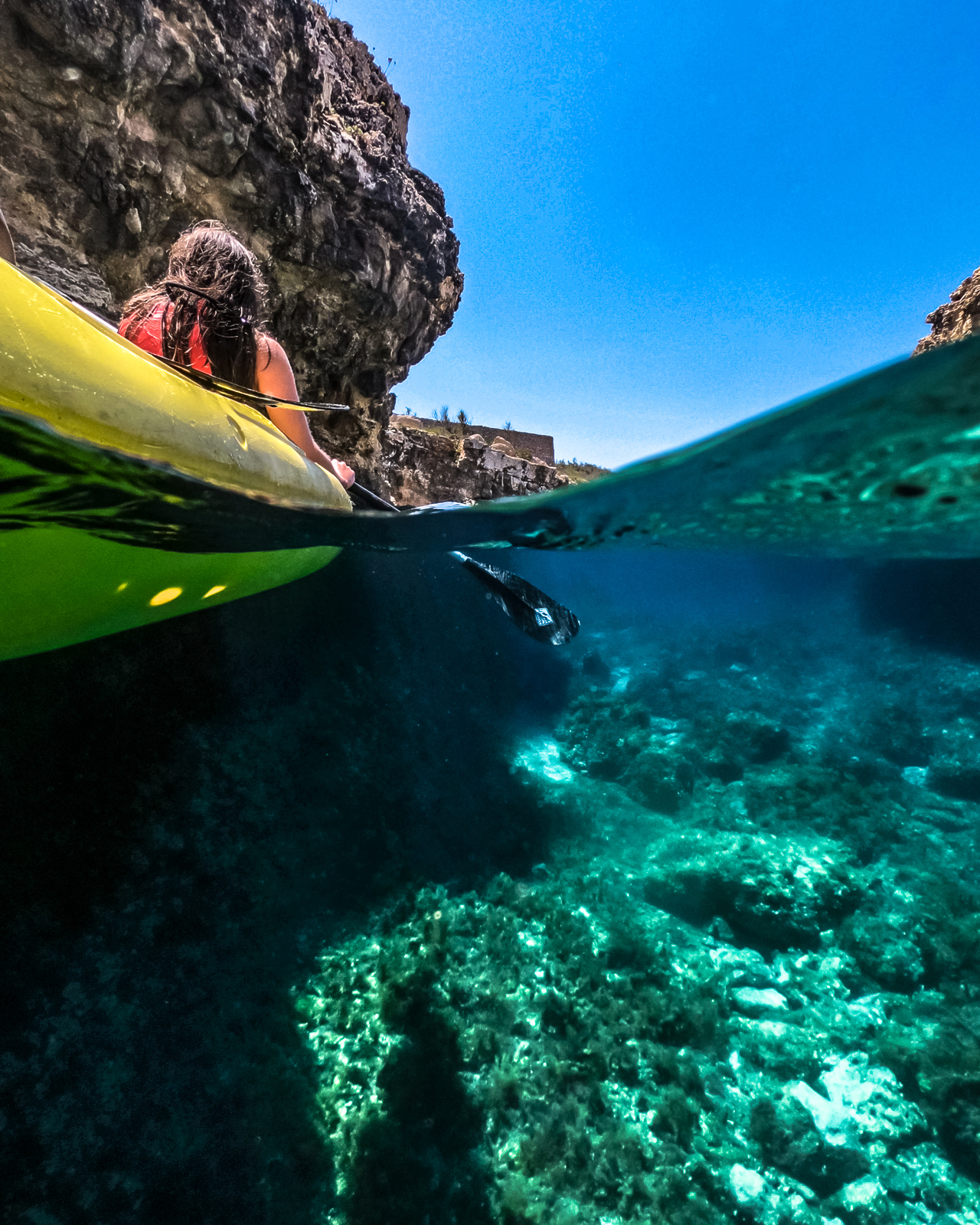 Underwater overwater kayak shot