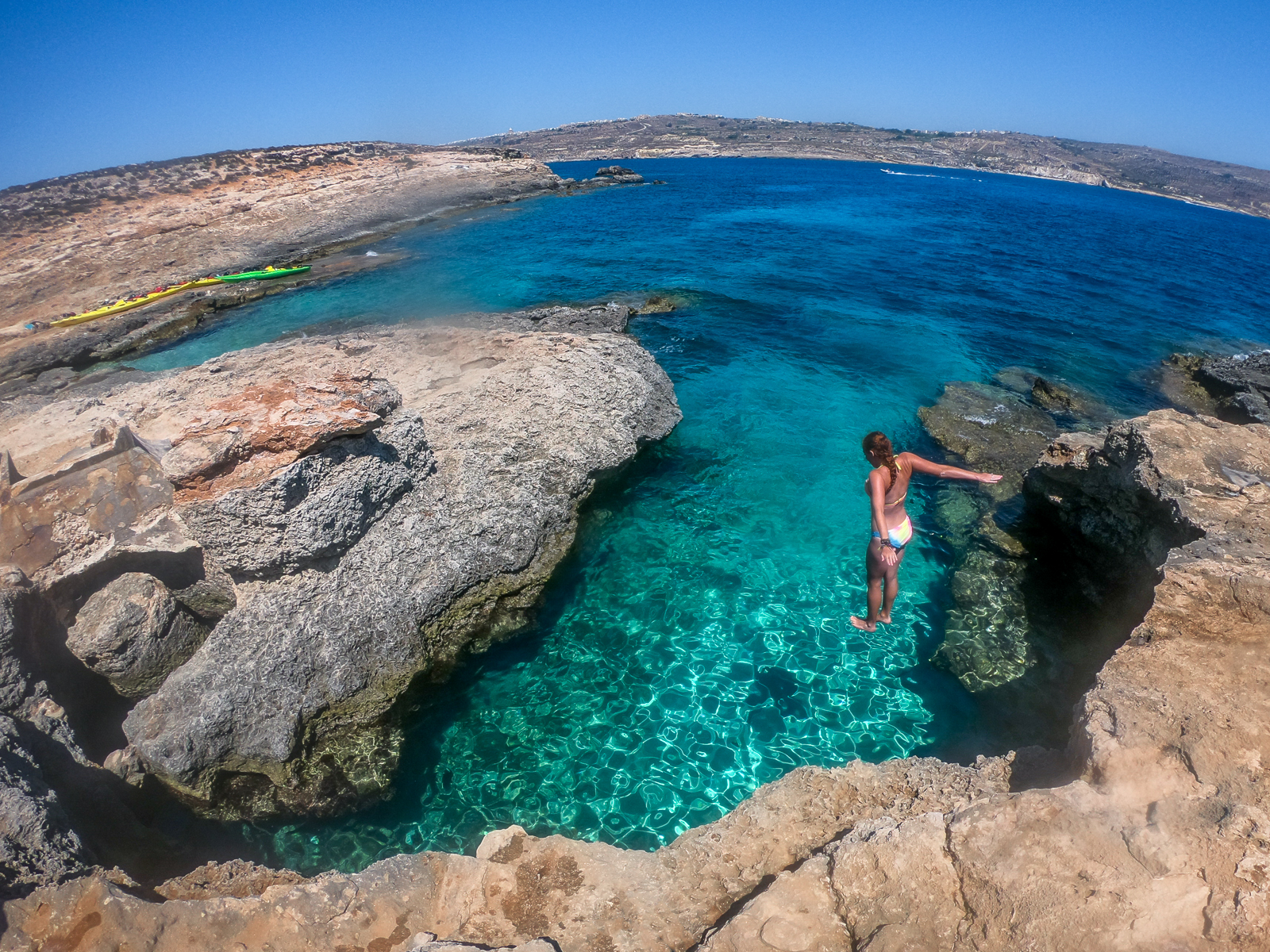 Cliff jumping in Comino