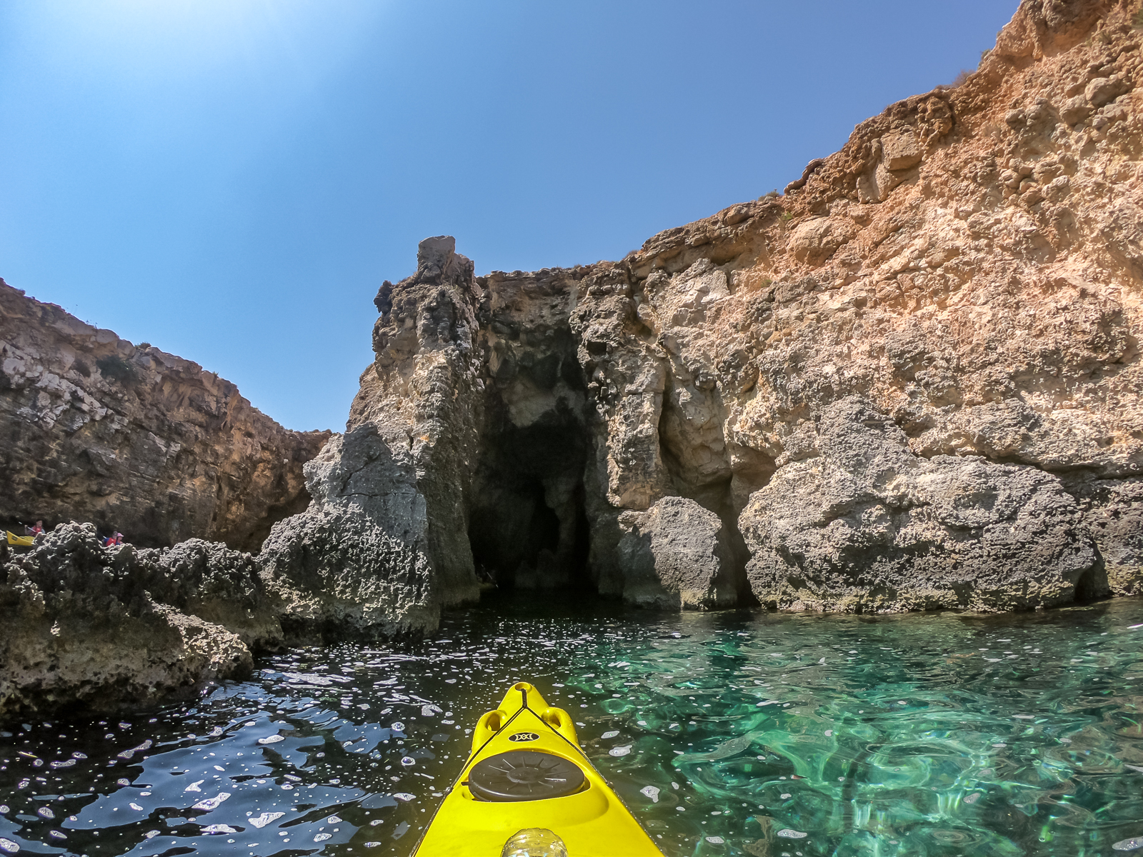 Kayaking into caves in Comino